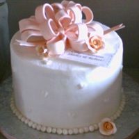 Bridal Shower Cake This was a 4-layer white cake with cream cheese and strawberry filling with buttercream icing and fondant pearl border and bow. I purchased...