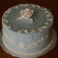 Practice Cake I wanted to practice with SMBC and try a gumpaste rose... I made this for a friend's anniversary. I used a stencil on the side, but...