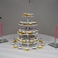 Cupcake Tower For Ladies Tea Cupcakes of various flavors and fillings. Iced with buttercream and topped with buttercream roses.