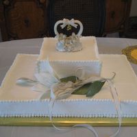 50Th Anniversary Buttercream icing with gumpaste white lily.
