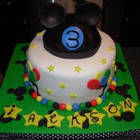 Mickey Mouse Ears Fondant covered cake and board with a gumpaste hat and ears. Thank you to all the people on here that helped me with the hat and ears! I...