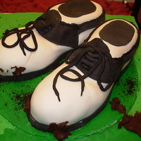 Golf Shoes These shoes don't smell at all like my husband's real ones do! Cake inside, fondant covered and fondant decorations.