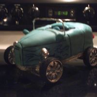 Hot Rod this was a quickie , white cake with store bought icing covered with mmf , foil covered parts and toy tires took abought 1.5 hrs.