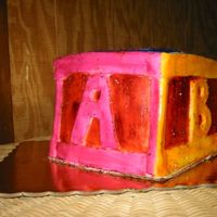 Baby Block here is the wooden baby block cake I just did. Such a small cake... so much trouble. The lemon curd filling kept making it slide everywhere...