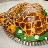 Sleeping Baby Giraffe Baby giraffe sleeping. covered in fondant and hand-painted. I had a slight mishap, the head fell off. I had to patch the fondant but my...