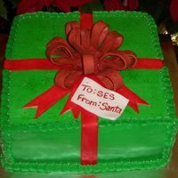 Christmas Present!! Devil's food cake with BC icing. Fondant bow. I made this for my school's christmas party.