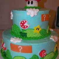 Super Mario Bros 10" and 6" rainbow cake (wish I had a pic of the inside after it was cut!) with buttercream frosting and MMF decor.