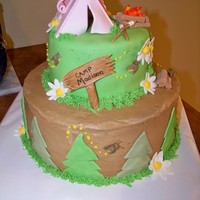 Camp Party 10" cake with buttercream; 6" cake covered in MMF. MMF trees/ flowers. Gumpaste everything else. This cake was for a little girl...