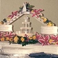 My Niece's Wedding Cake Multi-flavored layers/tiers, bc icing with string pearl decoration; silk flowers