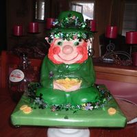Lucky Leprechaun this was my first st. patttys day cake , it is made from white cake , and mmf ... i used garland around the hat , and the bottom , just to...