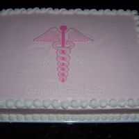Caduceus Strawberry cake w/ pink tinted cream cheese icing. BC piping and design.