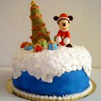 Mickey Covered panettone with fondant and RI. Fondant is airbrushed and mickey/tree is made from fondant with cmc