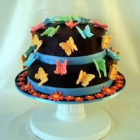 Butterflies And Chocolate Choc cake covered in ganache and RI run uot butterflies. Heavily influenced by Peggy Porschen!