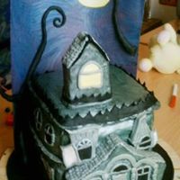 Haunted House Orange cake covered in fondant. Oh just to add the background is also edible, it's a sheet of painted sheet of pastillage.