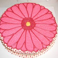 Gerbera Daisy This is made on a 12" round pan. French vanilla cake with buttercream icing. It was made for my MOPS (mother's of preschoolers)...