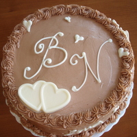 Wedding Shower Chocolate cake with raspberry and chocolate mousse filling. The hearts and the bride/groom's initials were done in white Ghiradelli...