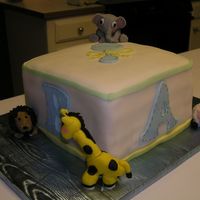 Baby Shower Cake White cake with buttercream icing and fondant. Animals are also made of fondant.