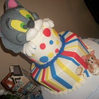 Tom And Jerry I am so proud of this cake. The cat looks like Tom, but the mouse looks like a very FAT Jerry - oh well, I'm still proud. The mouse is...