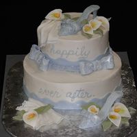 Double Bridal Shower WASC cake with raspberry filling. Gumpaste shoes, hankies, bows, border and calla lilies. Started as a cake for one bride- then had to...
