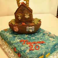 Noah's Ark Fondant animals- some freehand, some from molds. Candy clay covered 1/2 football for ark, on an 11x15 sheet cake iced in tri-color smbc fro...