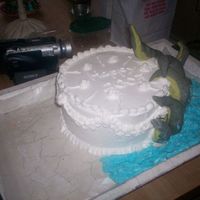 Kraken Cake I came up with the idea for this cake when I was waching "Pirates of the caribben 2 " the tentacles are foil coverd in fondant...