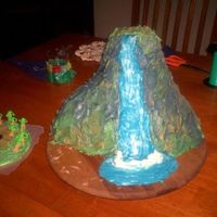 Waterfall Cake I made this cake for my little sisters 7th birthday. it's iced in butter cream and the palm trees are royal iceing. thanks for looking...