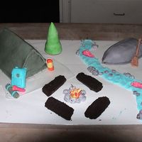 Camp Cake this cake is for my mom and my little sister they are coming back from girl scout camp tomorw. it's devils food cake coverd in MMF.