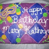 Madi Gras B-Day I matched the napkin for the party! The background is buttercream icing in a checker pattern and the mask and others are fondat/gumpaste.