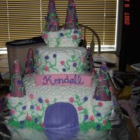 Castle Cake Got this idea from several of the cakes on this site! THANKS! 10" and 6"round with BC icing. The door is fondant and the cones...