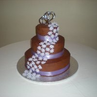 Chocolate And Fondant Daisy's Chocolate buttercream icing with fondant/gumpaste daisy's.