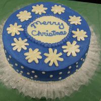 Blue Christmas Cake With White Chocolate Clay I made this to take to my MIL's christmas party. Huge hit. It is royal blue with butter cream, white chocolate snowflakes and white...