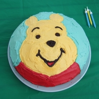 Winnie The Pooh Simple round cake decorated with buttercream icing.