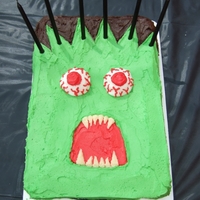 Monster Cake Simple rectangle cake with buttercream icing and giant marshmallow eyes - made for a scary monster themed party.