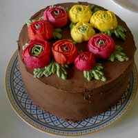Ranunculus Cake My first attempt at making buttercream flowers. Also my first attempt to use a piping bag and tips! Made at the same time as the peony cake...