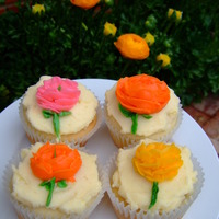 Ranunculus Cupcakes Buttercream ranunculi piped with a #104 tip.