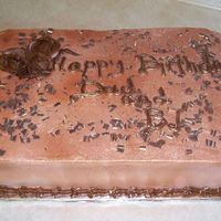 Happy Birthday Chocolate cake with buttercream sprayed with bronze luster spray and chocolate buttercream roses
