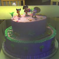 Dora Cake It's a chocolate cake with vanilla swiss buttercream filling. The frosting and designs were american buttercream.