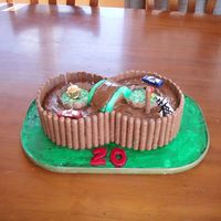 Racing Track! My first ever cake, not the best... but not too bad! Racing track fo rmy car nut Boyfriend. Chocolate ganache road... mmmm.