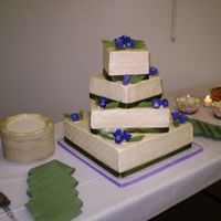 Square Wedding Red Velvet with BC icing, real ribbon, and gumpaste flowers & leaves. This was the cake from you know where. I baked it in Kansas and...