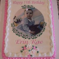 Erin_Rae.jpg Just a regular sheet cake for a little girl's 11th birthday--Daddy wanted his favorite picture of her on the cake! Buttercream icing...