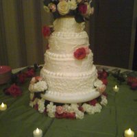 White Wedding With Fresh Flowers Crusting white butter cream frosting with piping work on all four layers. The cake is strawberry cake mix with the extender recipe added (...
