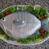 Something Fishy.. Inspired from a cake in Colette Peters' book. Sculpted cake, covered with fondant. Painted with Luster Dust. Fondant cherry tomatoes....