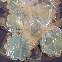 Pale Blue Flower Cookies Iced with fondant with royal icing piping.