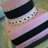 Pink, Black And White 8" square and 6" round, iced in rolled fondant with buttrcream and royal icing accents.