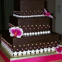 Brown And Pink Wedding Chocolate fondant with fondant pearls and flowers.