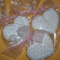 Heart Cookies Iced in fondant with royal icing piping.