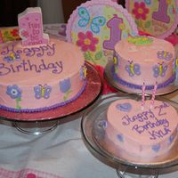 Emma's First, Kyla's Second Three little cakes for my daughter, and granddaughter. Buttercreme with fondant accents. small round was smash cake.