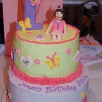 First Birthday pink buttercream birthday cake. little girl on top make of fondant/gumpaste to look like my granddaughter. number one made of gumpaste
