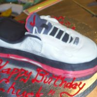 Nike Shoe Cake This is my son's "current" favorite shoe. I made it for his 14th birthday.Fondant and gumpaste