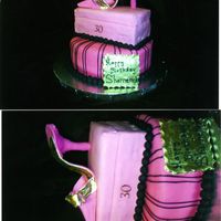 Jimmy Choo Gumpaste full size shoe atop acake shoe ox and cake. The client wanted Hot pink and black.